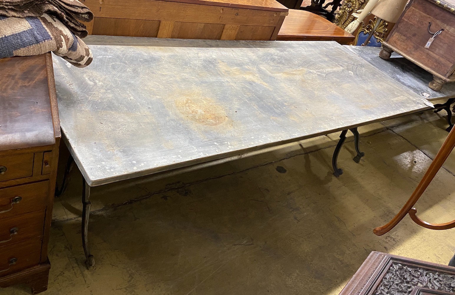 A rectangular zinc topped cast metal garden table, length 210cm, width 80cm, height 72cm